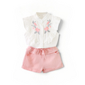 BabyEase Blossom & Ruffle set featuring a white embroidered blouse with cascading ruffles and pink linen shorts.