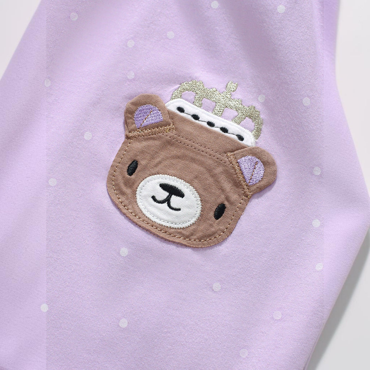 BabyEase lavender polka dot dress featuring a cute embroidered brown bear wearing a silver crown
