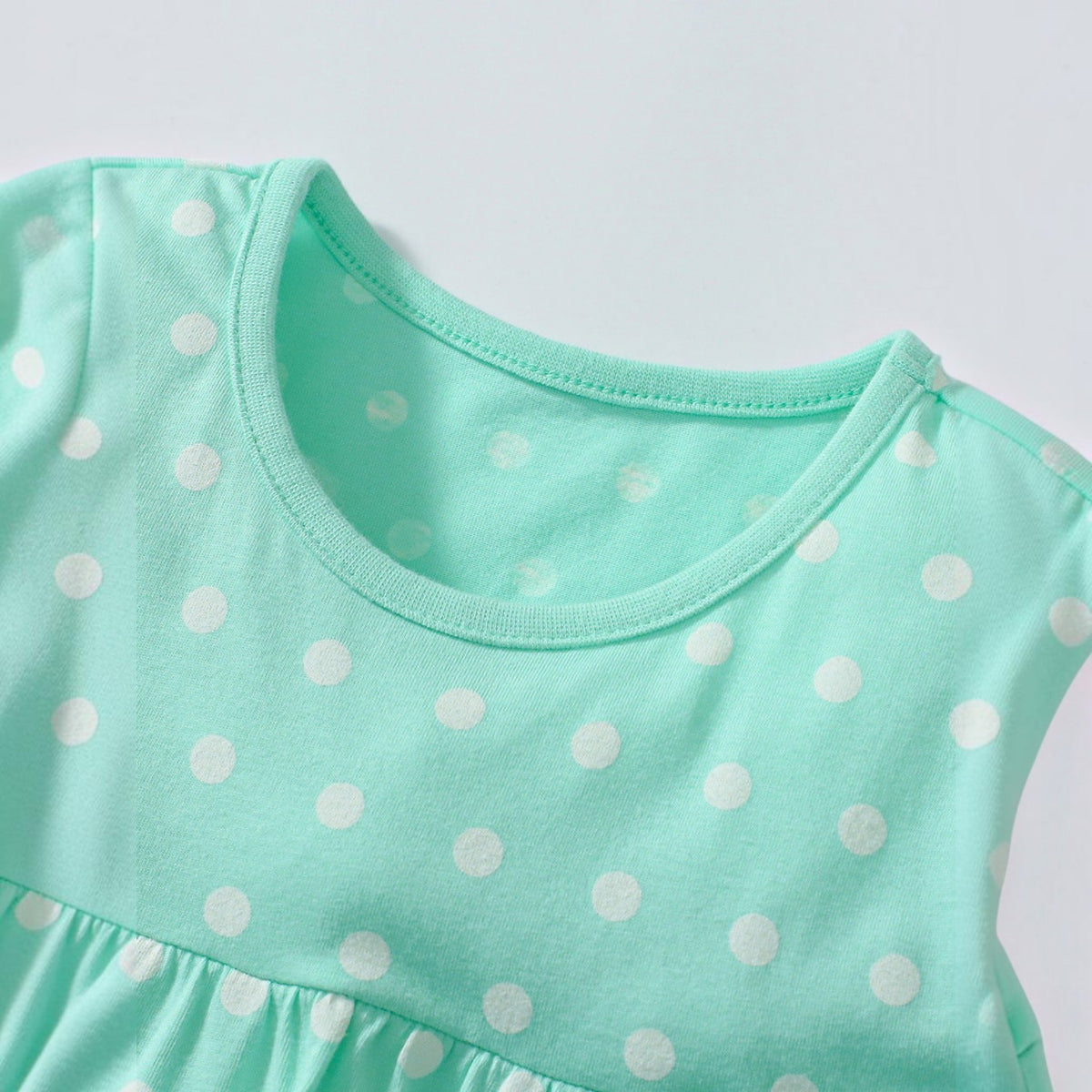 BabyEase mint green polka dot tunic top with a round neckline and soft cotton fabric for toddlers