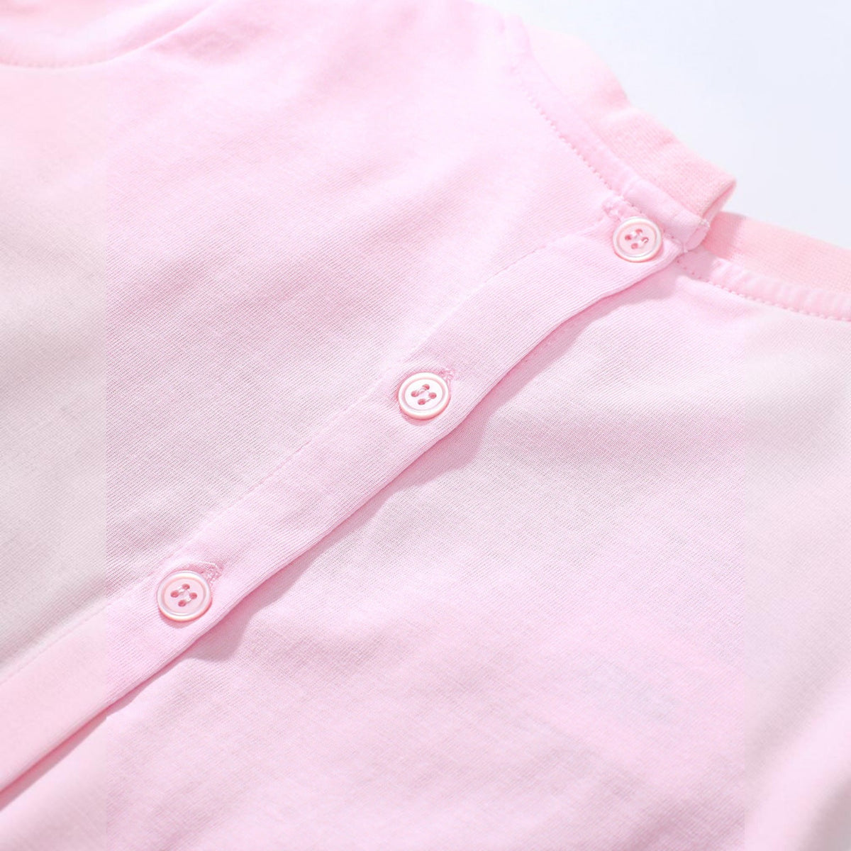 BabyEase pink cotton-blend dress back view featuring a button closure placket on the collar for easy dressing