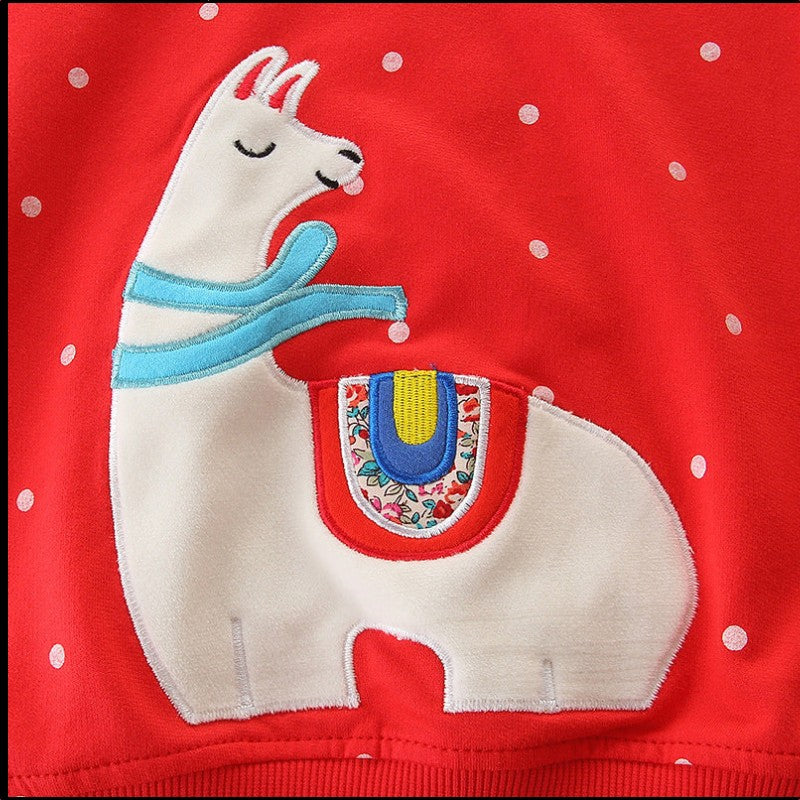 BabyEase red sweatshirt with white polka dots and a detailed embroidered llama applique wearing a blue scarf